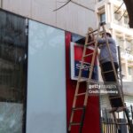 A worker installs a security camera outside a damaged Societe General de Banque au Liban SAL (SGBL) bank branch on Hamra Street in Beirut, Lebanon, on Wednesday, Jan. 15, 2020. Lebanese protesters spilled back into the streets on Tuesday after a brief letup, blocking major highways as they denounced the lack of a functioning government at a time of deepening financial and economic crisis. Photographer: Hasan Shaaban/Bloomberg via Getty Images