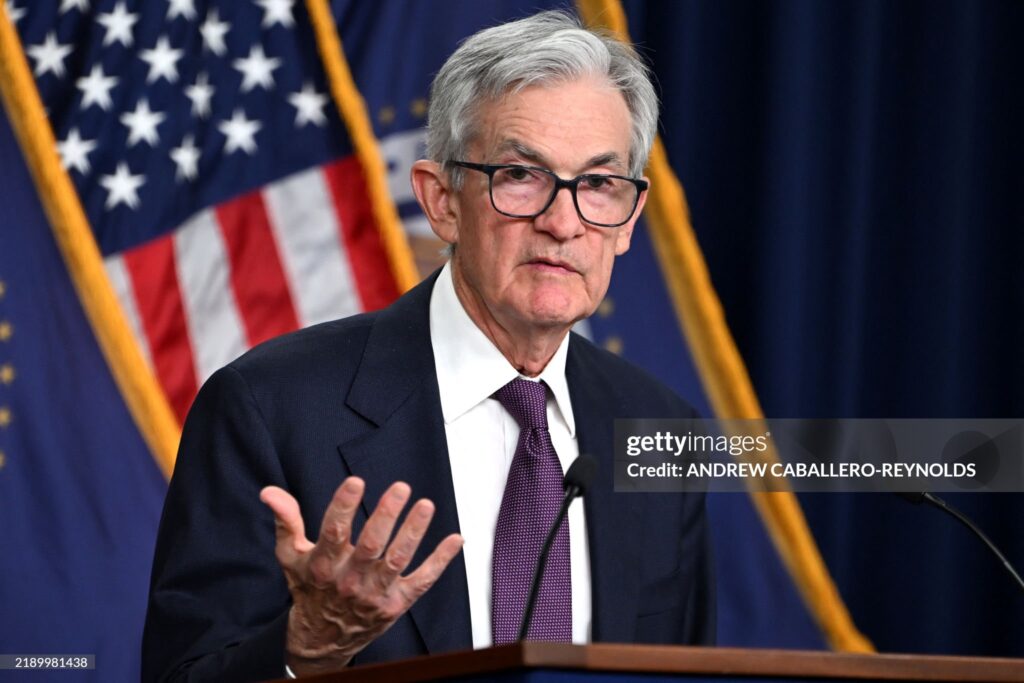 US Federal Reserve Chairman Jerome Powell gestures as he speaks at a press conference after the Monetary Policy Committee meeting in Washington, DC, on December 18, 2024. The US Federal Reserve cut interest rates by a quarter point December 18 and signaled a slower pace of cuts ahead, amid uncertainty about inflation and US President-elect Donald Trump's economic plans. Policymakers voted 11-to-1 to lower the central bank's key lending rate to between 4.25 percent and 4.50 percent, the Fed announced in a statement. They also penciled in just two quarter-point rate cuts for next year, and sharply hiked their inflation outlook for 2025. (Photo by ANDREW CABALLERO-REYNOLDS / AFP) (Photo by ANDREW CABALLERO-REYNOLDS/AFP via Getty Images)