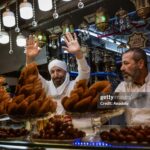 DAMASCUS, SYRIA - DECEMBER 23: People do shopping at Al-Hamidiyeh Souq after the fall of the 61-year-old Baathist regime in the capital Damascus, Syria on December 23, 2024. A new era began for the Syrian economy with hopes for recovery and rebuilding after years of conflict. (Photo by Emin Sansar/Anadolu via Getty Images)