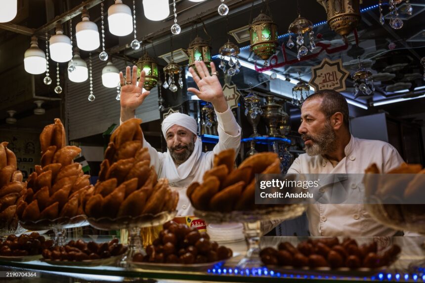 DAMASCUS, SYRIA - DECEMBER 23: People do shopping at Al-Hamidiyeh Souq after the fall of the 61-year-old Baathist regime in the capital Damascus, Syria on December 23, 2024. A new era began for the Syrian economy with hopes for recovery and rebuilding after years of conflict. (Photo by Emin Sansar/Anadolu via Getty Images)
