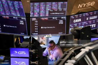 TOPSHOT - A trader works on the floor of the New York Stock Exchange (NYSE) at the opening bell in New York City on March 10, 2025. (Photo by CHARLY TRIBALLEAU / AFP) (Photo by CHARLY TRIBALLEAU/AFP via Getty Images)