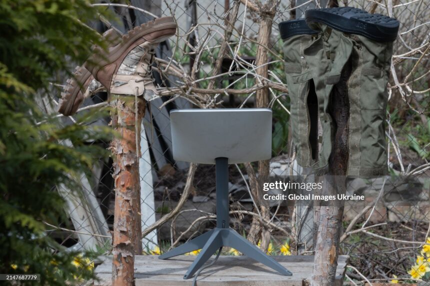 KUPIANSK, UKRAINE - APRIL 7: An antenna of the Starlink satellite-based broadband system stands in a yard next to the wooden posts on which shoes are dried on April 7, 2024 in Kupiansk, Ukraine. On 24 February 2022, Russia invaded Ukraine in an escalation of the Russian-Ukrainian War that started in 2014. After retreating from Kupiansk in September 2022, Russian military repeatedly shelled the city. (Photo by Yan Dobronosov/Global Images Ukraine via Getty Images)