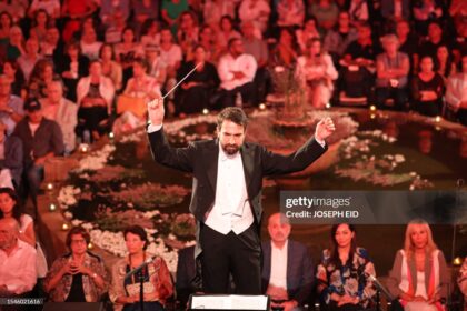 Lebanese maestro Lubnan Baalbaki conducts the orchestra during a performance by Egyptian Mezzo Soprano Farrah El-Dibany at the Beiteddine Festival, in the historic eponymous palace of Lebanon's Chouf mountains, on July 20, 2023. (Photo by Joseph EID / AFP) (Photo by JOSEPH EID/AFP via Getty Images)