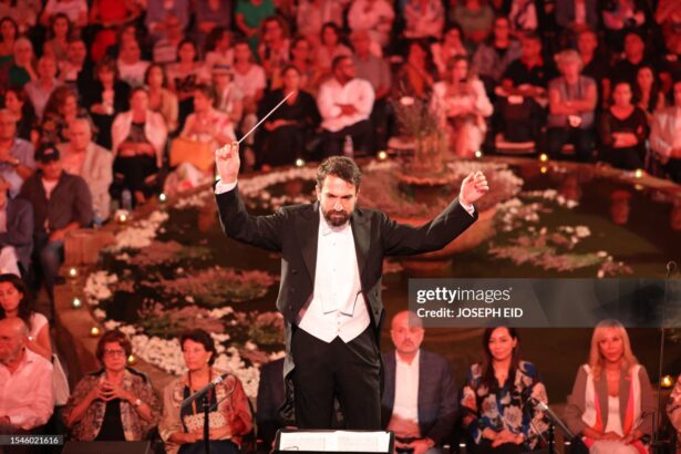 Lebanese maestro Lubnan Baalbaki conducts the orchestra during a performance by Egyptian Mezzo Soprano Farrah El-Dibany at the Beiteddine Festival, in the historic eponymous palace of Lebanon's Chouf mountains, on July 20, 2023. (Photo by Joseph EID / AFP) (Photo by JOSEPH EID/AFP via Getty Images)