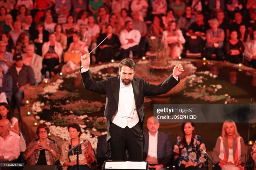 Lebanese maestro Lubnan Baalbaki conducts the orchestra during a performance by Egyptian Mezzo Soprano Farrah El-Dibany at the Beiteddine Festival, in the historic eponymous palace of Lebanon's Chouf mountains, on July 20, 2023. (Photo by Joseph EID / AFP) (Photo by JOSEPH EID/AFP via Getty Images)