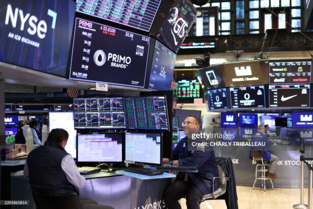 Traders work on the floor of the New York Stock Exchange (NYSE) in the Financial District in New York City on February 28, 2025. (Photo by CHARLY TRIBALLEAU / AFP) (Photo by CHARLY TRIBALLEAU/AFP via Getty Images)