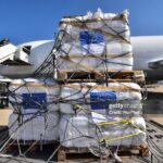Workers unload a humanitarian aid shipment provided by the European Union at the Beirut International Airport in Beirut, Lebanon, on October 15, 2024. Israel increases its strikes on what it says are sites for the Lebanese militant group Hezbollah and its allies since September 23, following almost a year of cross-border fire, resulting in the deaths of more than 1,200 people and the displacement of around a million from their homes. (Photo by Fadel Itani/NurPhoto via Getty Images)